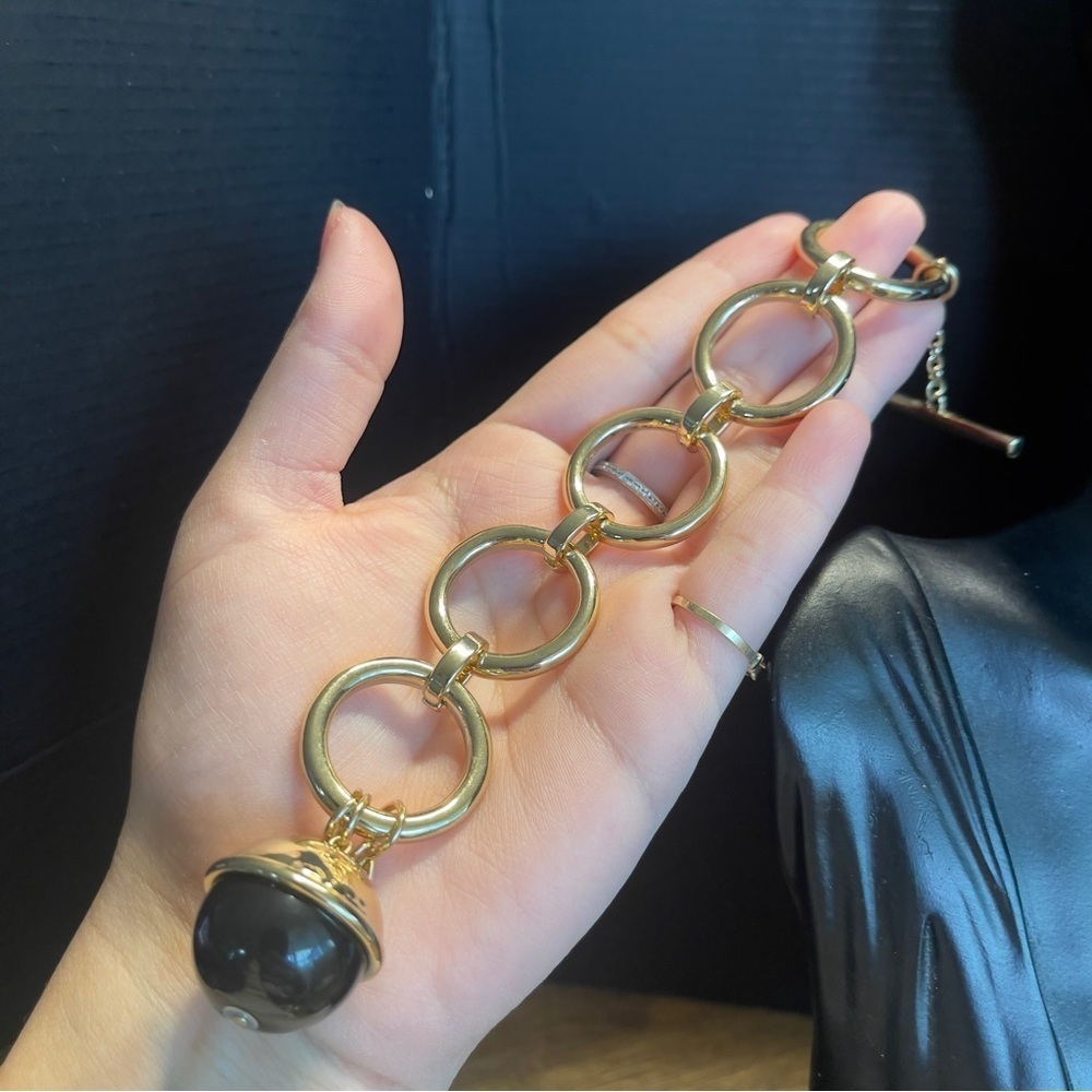 Gold tone Trina Turk 7 inch statement black ball bracelet
